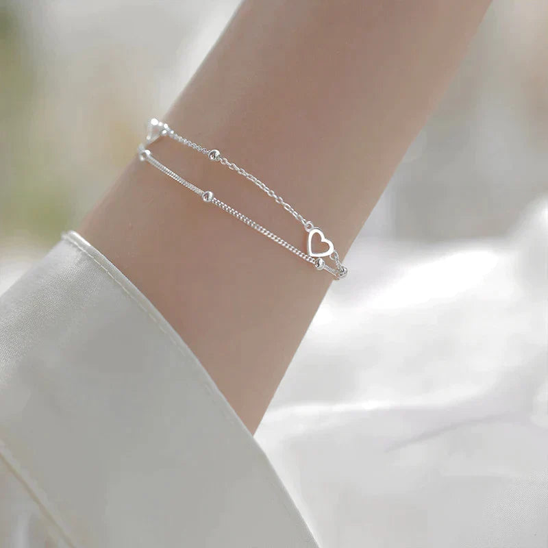 Justerbart silverarmband med hjärtformat hänge
