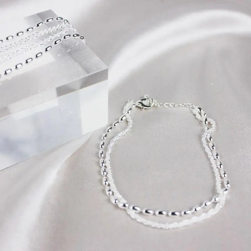 Set med silverarmband med zirkon