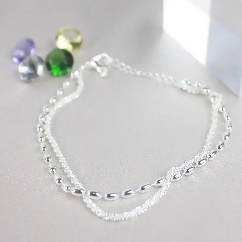 Set med silverarmband med zirkon