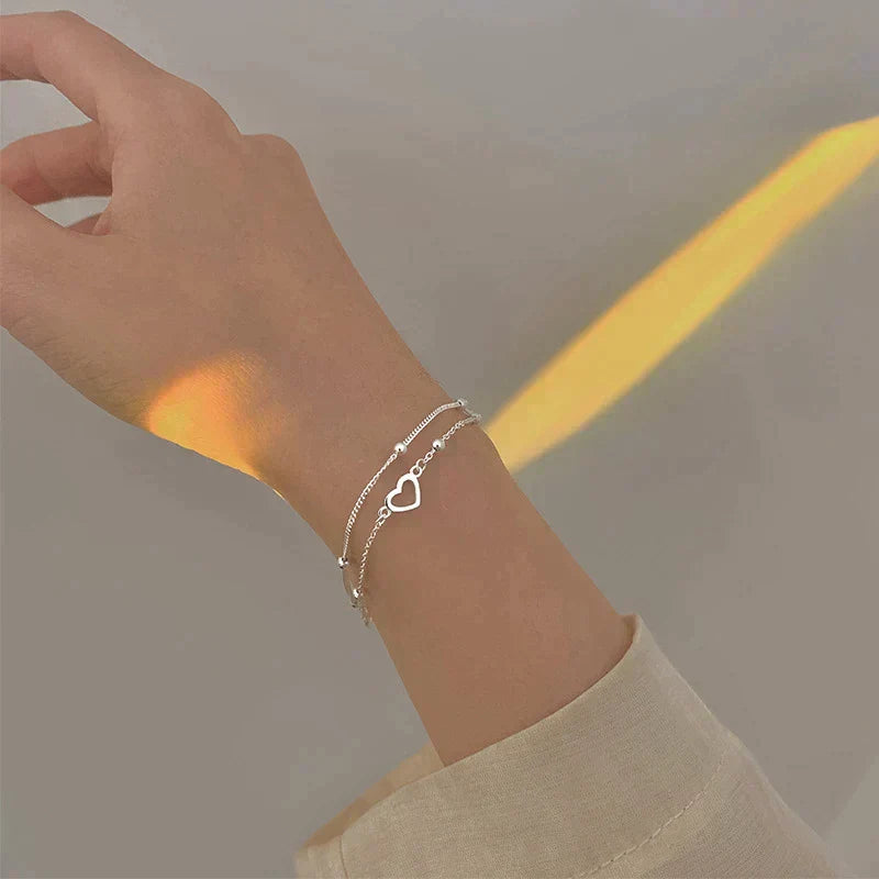 Justerbart silverarmband med hjärtformat hänge