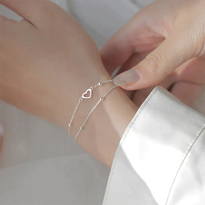 Justerbart silverarmband med hjärtformat hänge