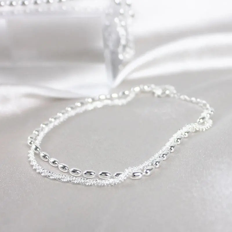 Set med silverarmband med zirkon