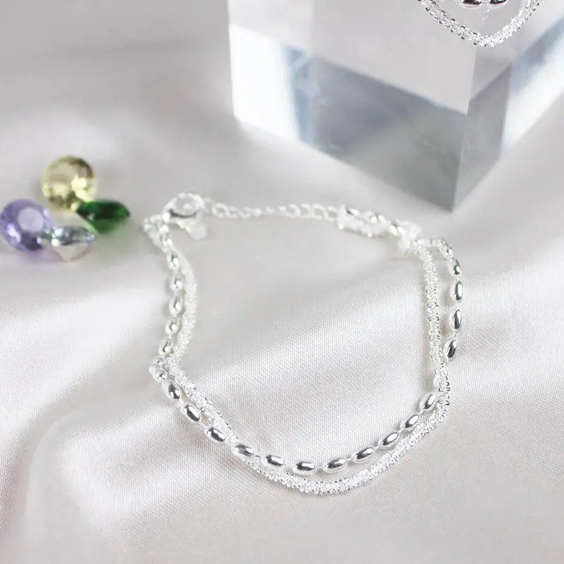 Set med silverarmband med zirkon