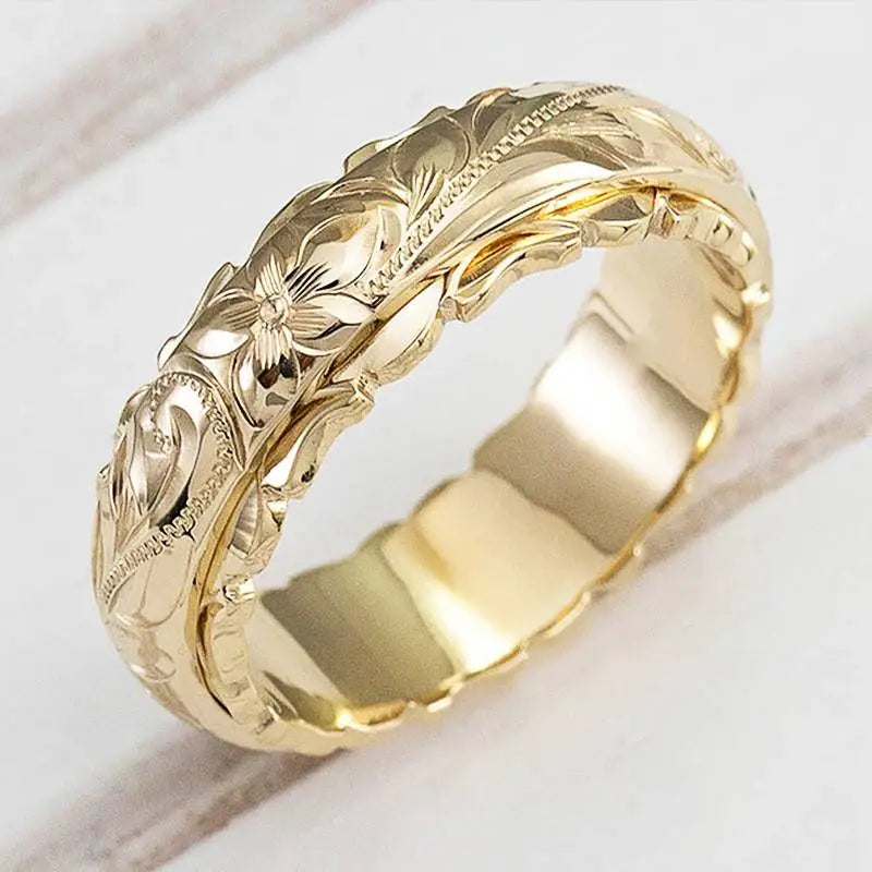 Vintagering i guld med blommönster